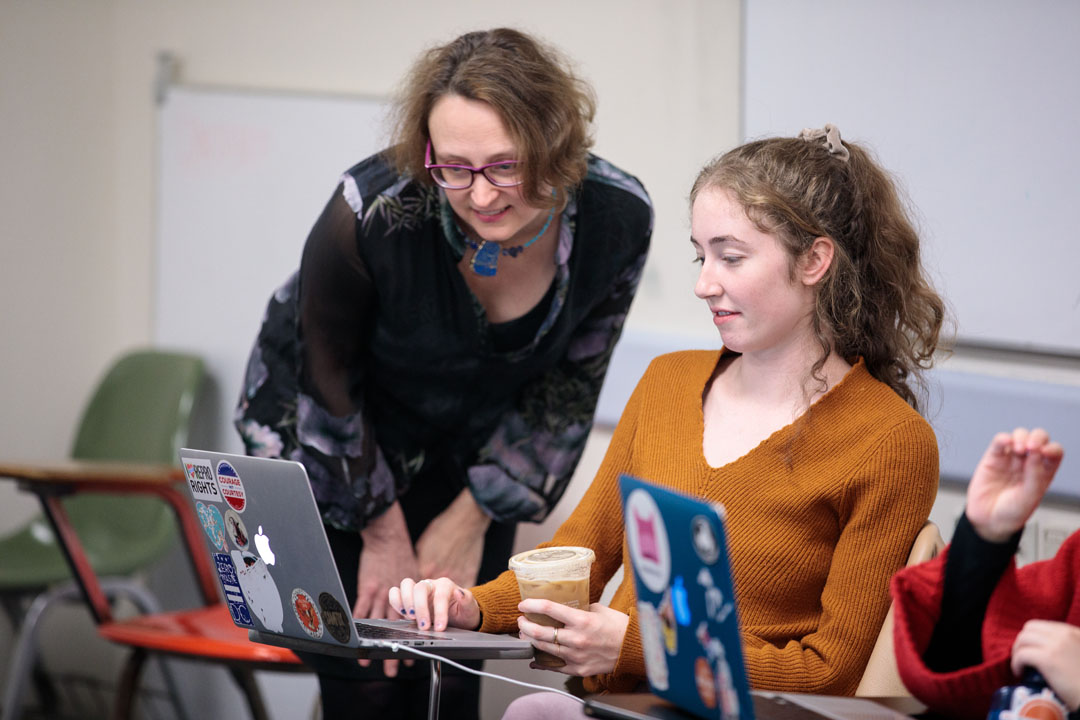 Professor Michelle Kelso helps a student in class