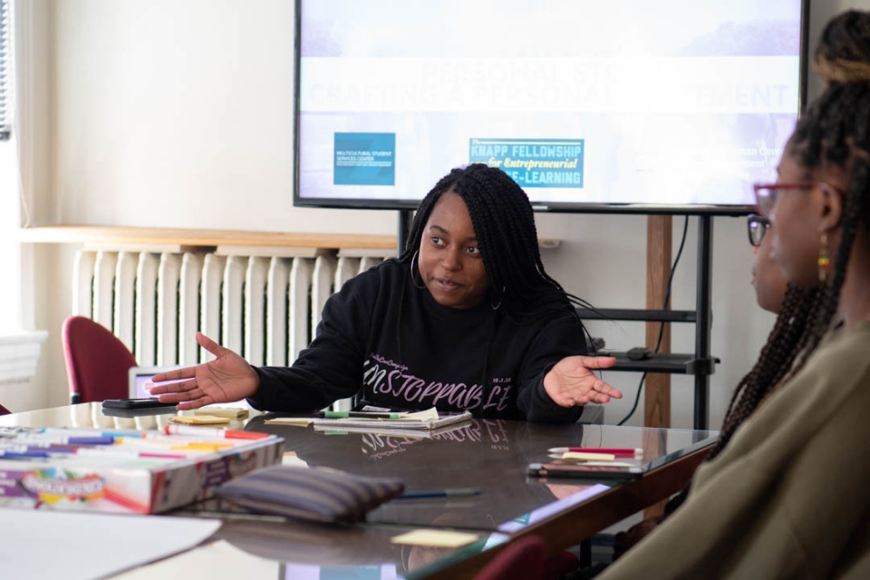 Zaniya Lewis works with high school students at the School Without Walls