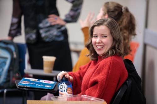 A student smiling in class